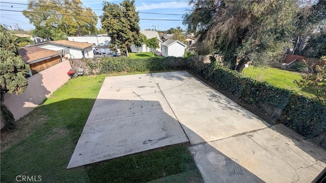 view of patio featuring a residential view and fence
