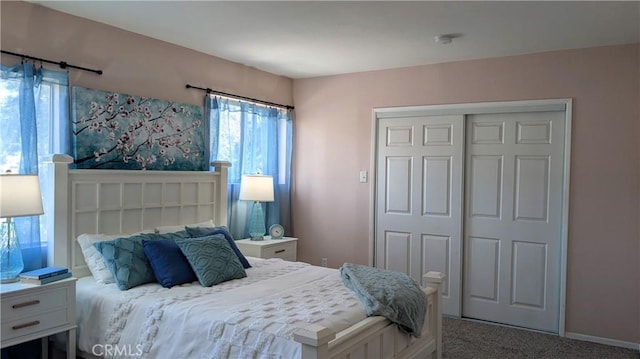 bedroom with carpet and a closet