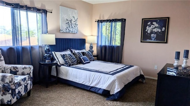 carpeted bedroom with baseboards