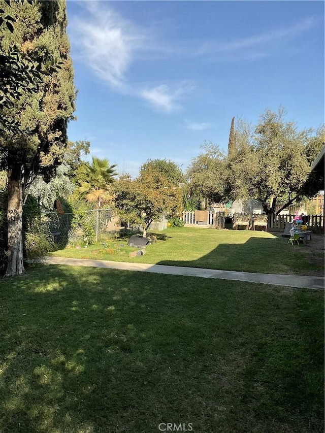 30500 Rd 72 # A, Visalia, CA 93291 - view of community with fence and a yard
