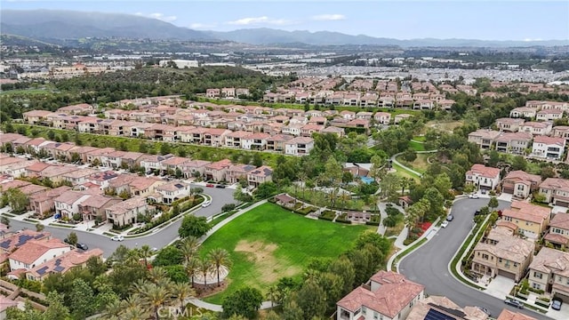 birds eye view of property with a residential view and a mountain view