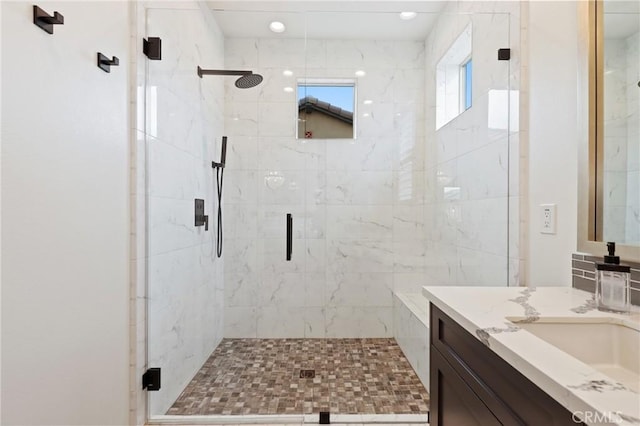 bathroom featuring vanity and a stall shower