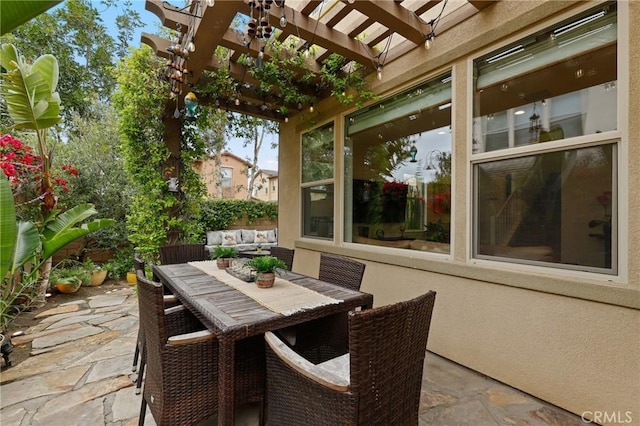view of patio with a pergola and outdoor dining space