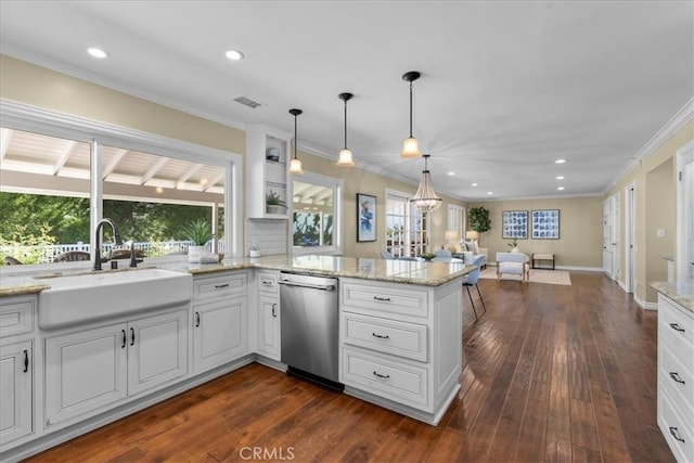 kitchen featuring a sink, a peninsula, open floor plan, stainless steel dishwasher, and visible vents
