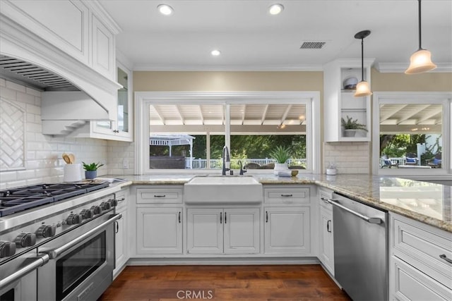 kitchen featuring visible vents, a sink, appliances with stainless steel finishes, and a wealth of natural light