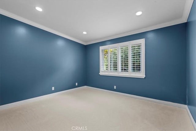 unfurnished room with baseboards, ornamental molding, carpet, and recessed lighting