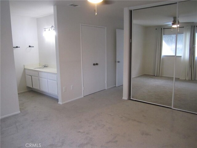 2321 S Magnolia Ave Unit 6A, Ontario, CA 91762 - unfurnished bedroom with light colored carpet, a ceiling fan, and visible vents