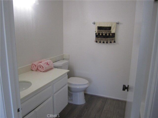 2321 S Magnolia Ave Unit 6A, Ontario, CA 91762 - half bath with vanity, toilet, and wood finished floors