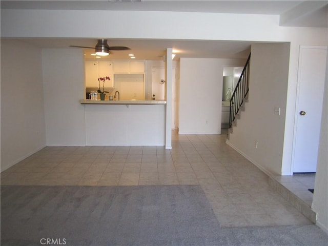 2321 S Magnolia Ave Unit 6A, Ontario, CA 91762 - unfurnished living room featuring visible vents, baseboards, ceiling fan, stairway, and light tile patterned floors
