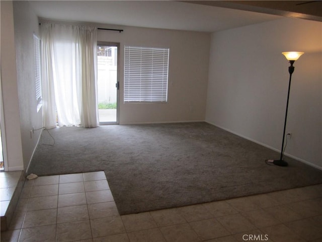 2321 S Magnolia Ave Unit 6A, Ontario, CA 91762 - carpeted empty room featuring baseboards and tile patterned flooring