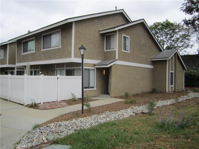 2321 S Magnolia Ave Unit 6A, Ontario, CA 91762 - view of front of property featuring fence and stucco siding