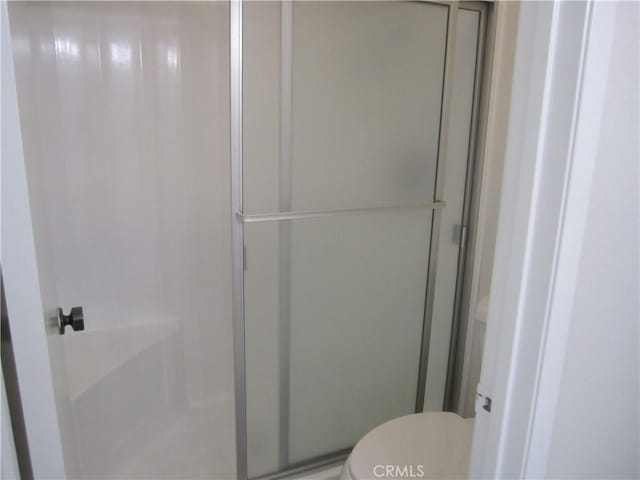 2321 S Magnolia Ave Unit 6A, Ontario, CA 91762 - bathroom with a shower stall and toilet
