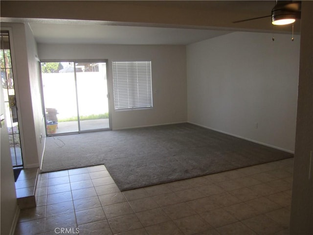 2321 S Magnolia Ave Unit 6A, Ontario, CA 91762 - carpeted spare room with a ceiling fan, baseboards, and tile patterned floors