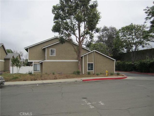 2321 S Magnolia Ave Unit 6A, Ontario, CA 91762 - view of property exterior with stucco siding and fence