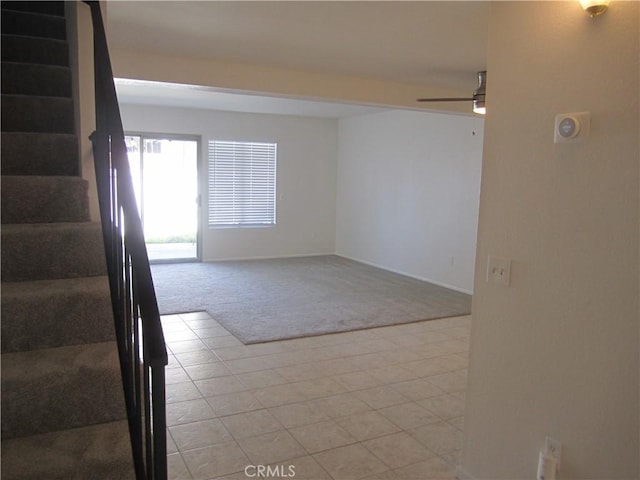 2321 S Magnolia Ave Unit 6A, Ontario, CA 91762 - unfurnished room with ceiling fan, stairway, baseboards, light carpet, and light tile patterned flooring