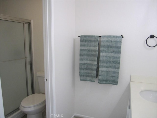 2321 S Magnolia Ave Unit 6A, Ontario, CA 91762 - bathroom with vanity, a shower stall, and toilet