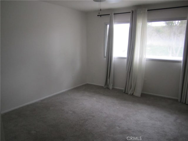 2321 S Magnolia Ave Unit 6A, Ontario, CA 91762 - carpeted empty room with baseboards and a wealth of natural light