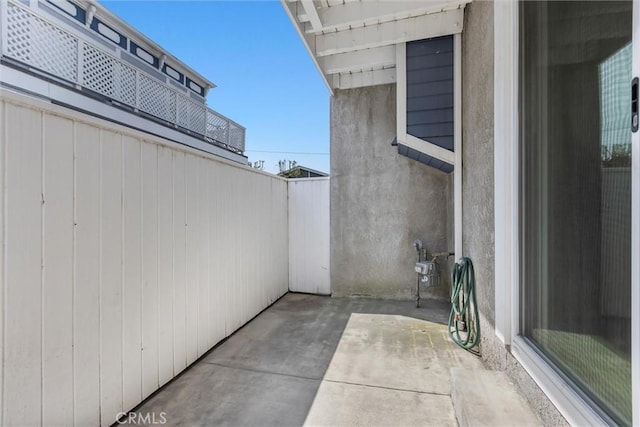 view of patio / terrace featuring fence