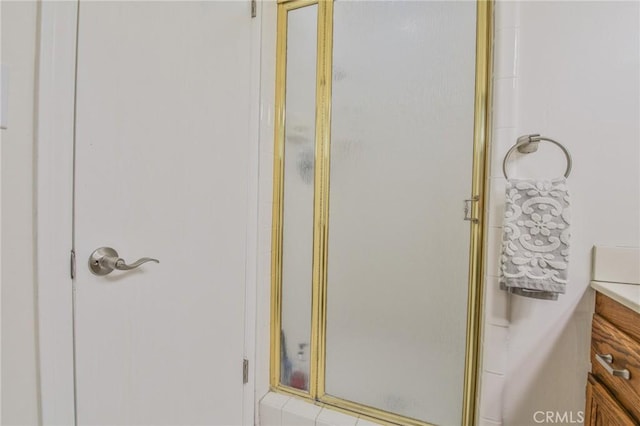 full bathroom featuring vanity and a shower stall