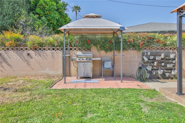 view of yard with a gazebo, fence, and a patio