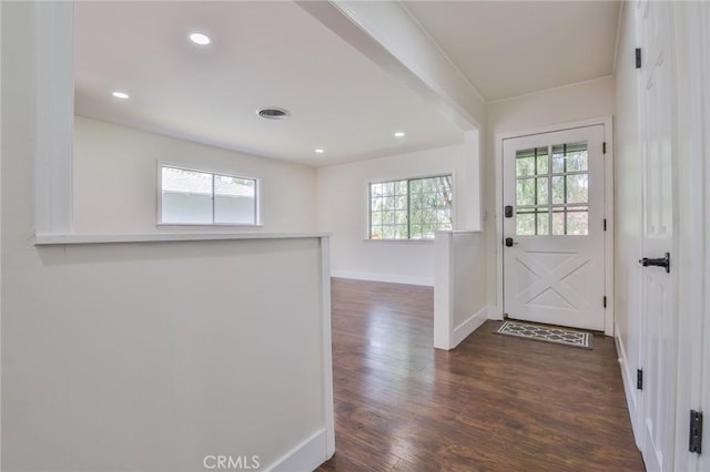 doorway featuring baseboards, visible vents, recessed lighting, and dark wood-type flooring