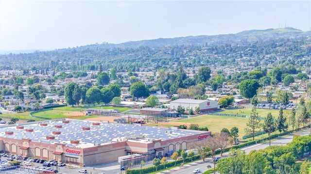 birds eye view of property with a mountain view