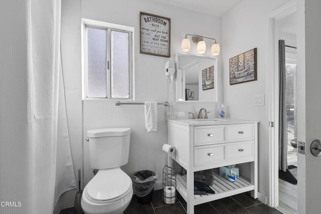 1104 E Big Bear Blvd, Big Bear, CA 92314 - full bathroom featuring toilet, a healthy amount of sunlight, tile patterned flooring, and vanity