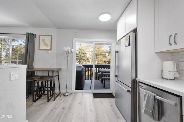 1104 E Big Bear Blvd, Big Bear, CA 92314 - kitchen with white cabinetry, appliances with stainless steel finishes, a wealth of natural light, and light wood finished floors