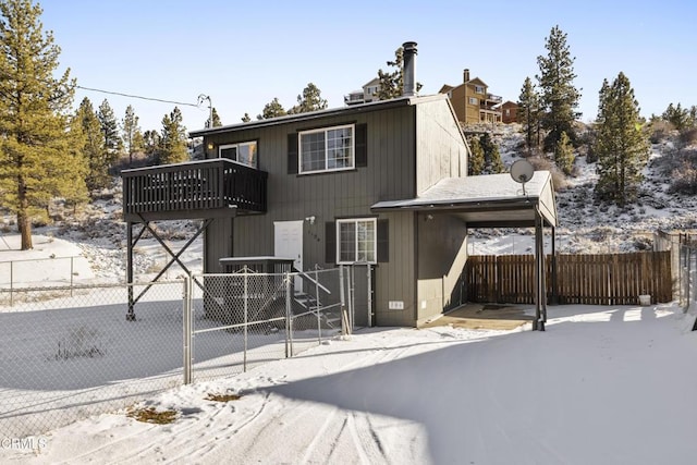 1104 E Big Bear Blvd, Big Bear, CA 92314 - snow covered rear of property featuring fence private yard and a balcony