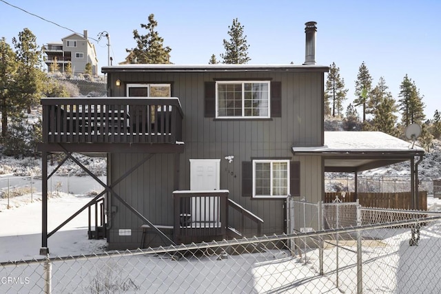 1104 E Big Bear Blvd, Big Bear, CA 92314 - snow covered rear of property featuring fence and a balcony