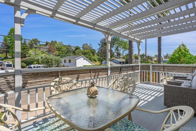 view of patio / terrace featuring a pergola and outdoor dining space