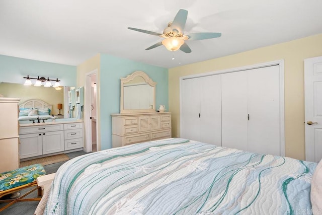 bedroom featuring a closet, ceiling fan, ensuite bath, and light wood-type flooring