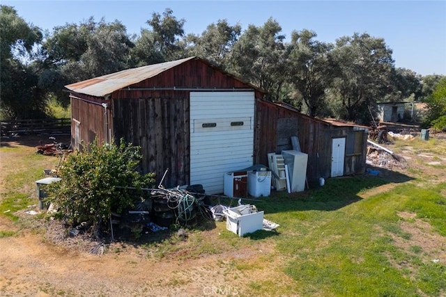view of pole building with a yard