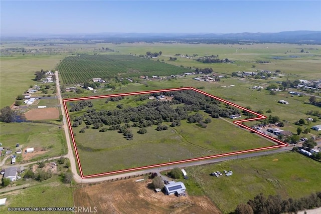 birds eye view of property featuring a rural view