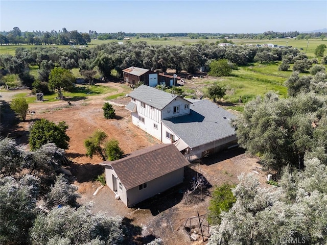 birds eye view of property with a rural view