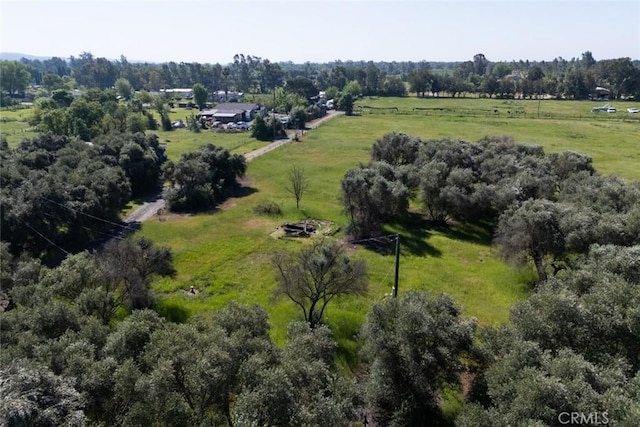 birds eye view of property with a rural view