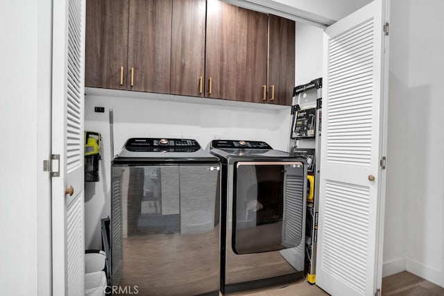 laundry room featuring cabinet space and independent washer and dryer