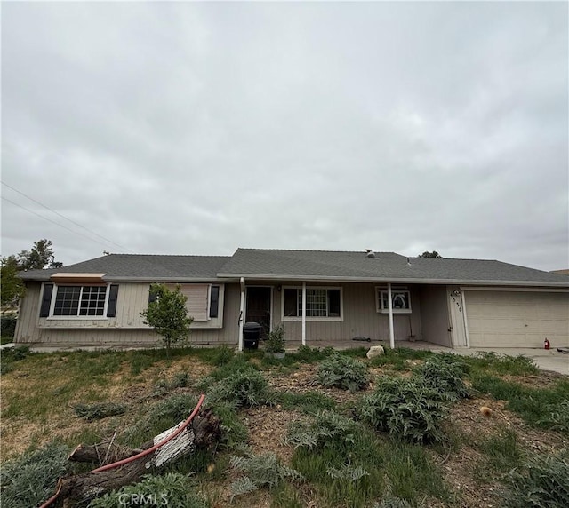ranch-style home featuring driveway and a garage