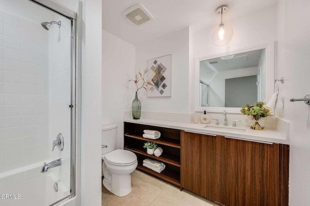 full bath featuring visible vents, vanity, toilet, tile patterned floors, and combined bath / shower with glass door