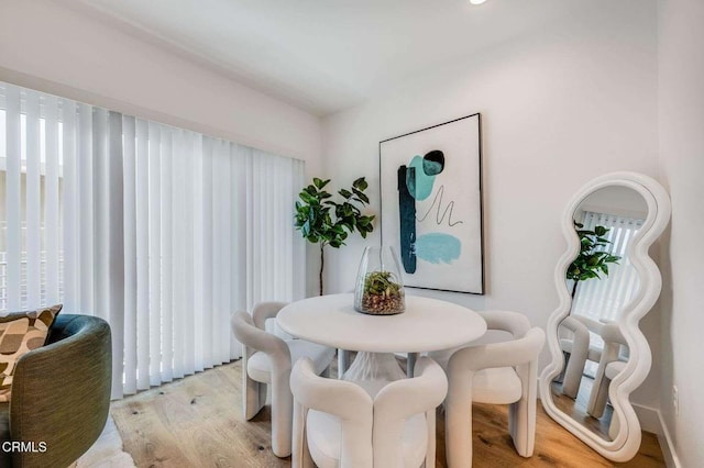 dining room with light wood-style flooring