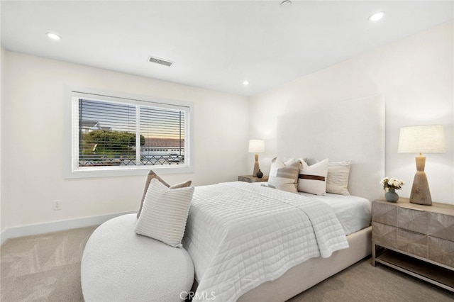 carpeted bedroom featuring recessed lighting, baseboards, and visible vents