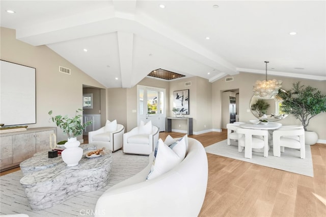 living room featuring an inviting chandelier, vaulted ceiling with beams, light wood-type flooring, and visible vents
