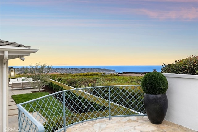 balcony featuring a water view