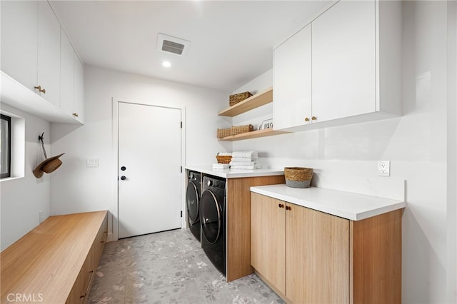 washroom with cabinet space, recessed lighting, independent washer and dryer, and visible vents