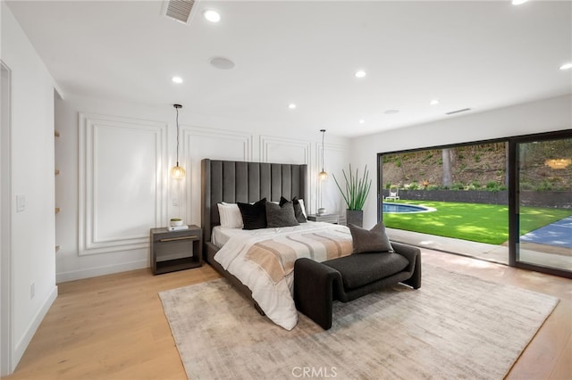 bedroom featuring access to outside, recessed lighting, light wood-style floors, and visible vents