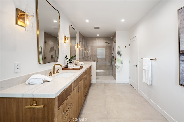 full bathroom with double vanity, recessed lighting, a sink, and a stall shower