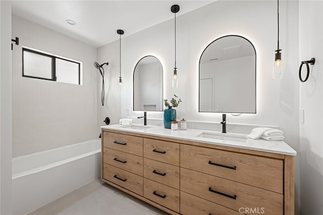 bathroom with a sink, double vanity, and tub / shower combination