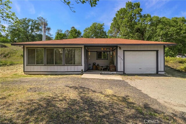 view of front of home with a garage and driveway