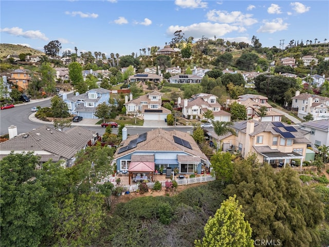 birds eye view of property with a residential view