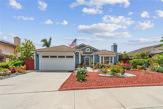 view of front facade featuring a garage, fence, a tiled roof, and concrete driveway
